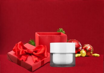 White bottle cosmetic product and red giftbox. Christmas sale of beauty products concept.