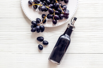 Balsamic vinegar with bunch of fresh grapes