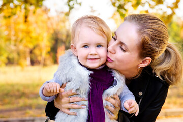 happy mom kisses the child. mother and baby.