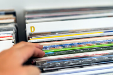 Choosing the vinyl album in the vinyl record shop