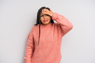 black afro woman panicking over a forgotten deadline, feeling stressed, having to cover up a mess...