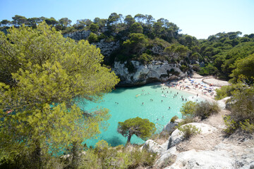 Fototapeta na wymiar Cala Macarelleta in Menorca. Menorca is one of the Spanish Balearic Islands in the Mediterranean Sea. It is known for the rocky and turquoise beaches and bays called 
