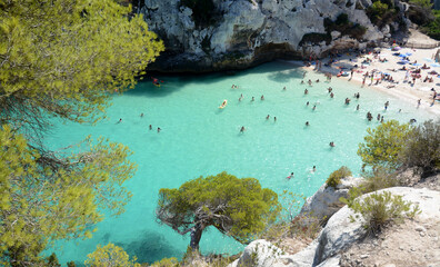 Cala Macarelleta in Menorca. Menorca is one of the Spanish Balearic Islands in the Mediterranean Sea. It is known for the rocky and turquoise beaches and bays called 