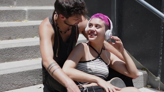 Young couple in love is listening to music together. 