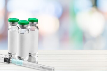 Syringe, three vials of coronavirus vaccine.The concept of medicine, healthcare