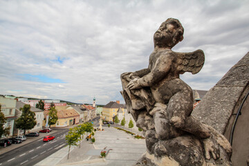 Sculpture on the roof of iconic baroque mountain church in Eisenstadt - obrazy, fototapety, plakaty