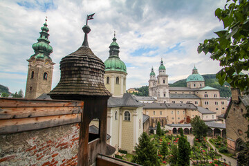 Fototapeta na wymiar Scenic view of the Salzburg cathedral an old church and a graveyard