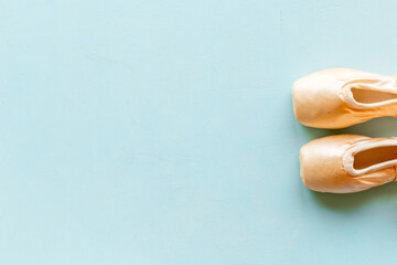 Pastel beige ballet pointe shoes or slippers with ribbon