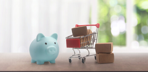 Toy shopping cart and Piggy bank and box