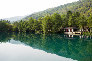 Fototapeta na wymiar house on the shore of a mountain lake