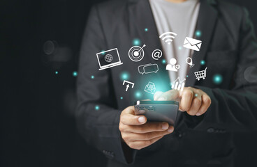Fototapeta premium Businessman using smartphone, notification social multimedia icons internet connection application digital network marketing online communication.