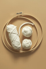 Macrame. Handmade macrame weaving and cotton threads on a rustic wooden stick. Scandinavian style in the interior, boho style. Cozy home recycling, zero waste,eco friendly, small business