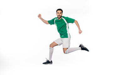 Fototapeta na wymiar happy young football player in uniform jumping isolated on white.