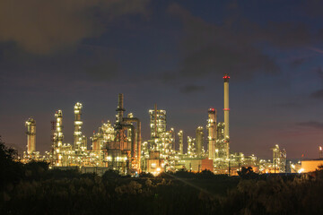 Fototapeta na wymiar Oil​ refinery​ and​ plant and tower of Petrochemistry industry in oil​ and​ gas​ ​industry with​ cloud​ blue​ ​sky the night