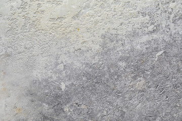 Gray concrete wall with uneven surface