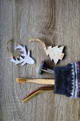 Christmas stocking filled with sustainable gifts and wooden decorations. Flat lay.