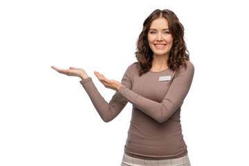 sale, shopping and business concept - happy female shop assistant with name tag holding something imaginary on her hand over white background