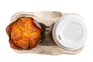 Muffin and plastic cup with hot drink in cardboard tray isolated on white background. Top view....
