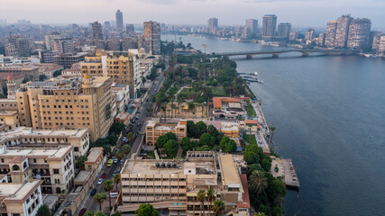 Cairo from a height. The blue Nile and the bridge over it are visible. Skyscrapers and city...
