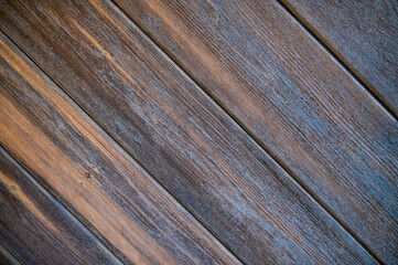 Decorative wooden planks, partially painted in blue, arranged diagonally