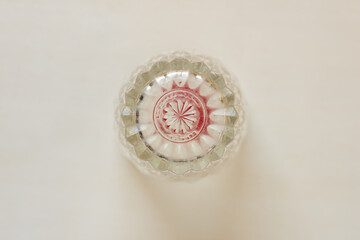 grungy, soiled drinking glass (upside down) on paper