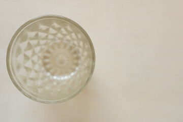 grungy, soiled drinking glass on paper