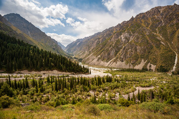 Scenic green valley in Ala Archa national park. Ala Archa Alpine National Park Landscape near Bishkek, Tian Shan Mountain Range, Kyrgyzstan, Central Asia.