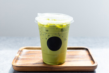 Green tea latte in plastic cup.