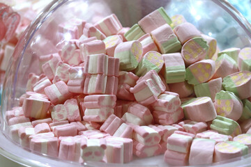 Marshmallows in the shape of pink panda bears in the background. Valentine's Day Concept
