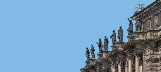 Old roof statutes of high ranked priests and saints lined up in Catholic Cathedral of Holy Trinity,...