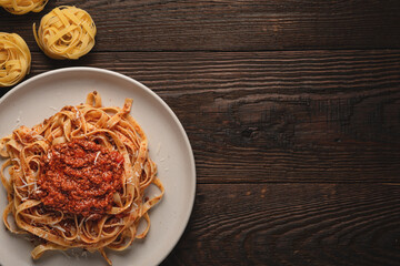 Pasta tagliatelle with BOLOGNESE SAUCE top view with copy space © SerPhoto