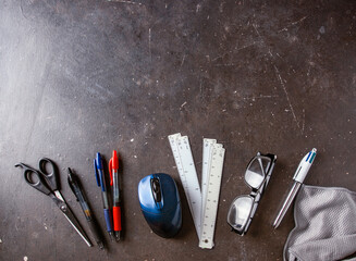Different school and university accessories pen, glasses, notebook, rules and board cleaning cloth ...