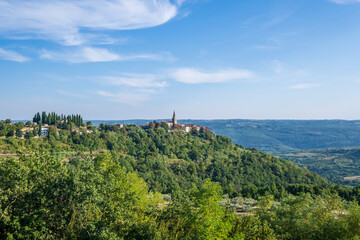 View of the green hills and colorful houses of the medieval town of Groznjan, Istria, Croatia.View...