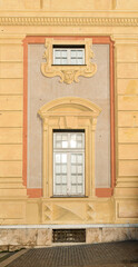 Detail of the side of Palazzo Ducale overlooking Piazza De Ferrari square with a typical trompe-l'oeil fresco, Genoa, Liguria, Italy