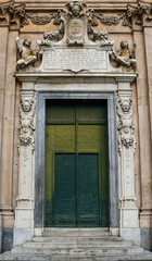Portal of the Church of Jesus (Chiesa del Gesù, 16th century), with bas-reliefs and marble sculptures in Baroque style, in the center of the coastal town, Genoa, Liguria, Italy