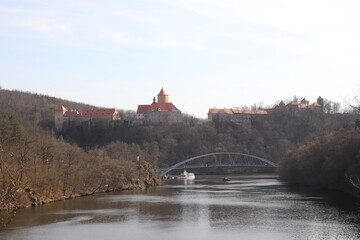 A view to the Veveri castle above the river and boat in front near Brno, Czech republic 
