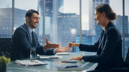 Female and Male Business Partners Have Fun and Play Rock Paper Scissors while Meeting Discussing Corporate Strategy, Financial Reports and Marketing Projects. Corporate Decisions Rely on Chance.