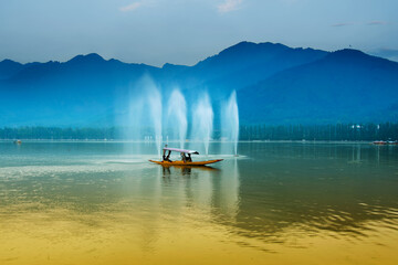 Reflection of Himalayan mountains on Dal Lake, Srinagar, Jammu and Kashmir, India. Houseboats...