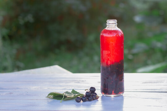 Black currant berry juice on a hot summer evening