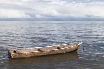 Obraz premium Old wooder boat is anchored at Samana bay