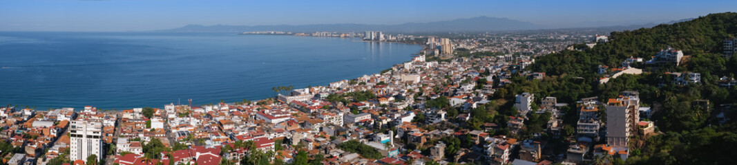 Fototapeta na wymiar Aerial panoramic view of Puerta Vallarta town and Bay of Banderas, sunny day, blue sky. Travel, vacation, sightseeing concept.