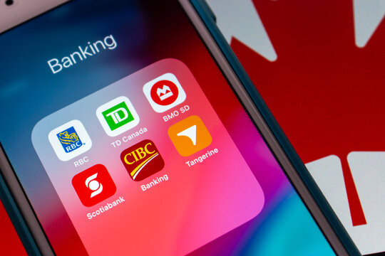 Kumamoto, JAPAN - Aug 10 2021 : Popular Canadian banks, Royal Bank of Canada, TD Canada Trust, Bank of Montreal, Scotiabank, Canadian Imperial Bank of Commerce, Tangerine on iPhone on Canadian flag