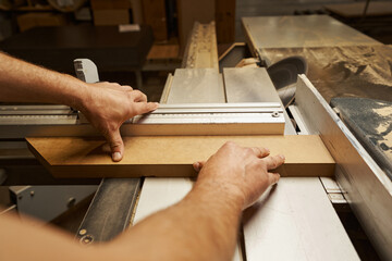 Focused photo on master machining borders of plank