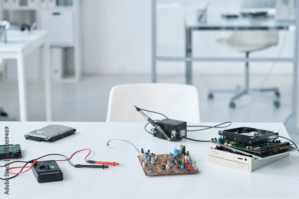 Poster Workplace of repairman or technician with hardware and tools on background of laboratory environment
