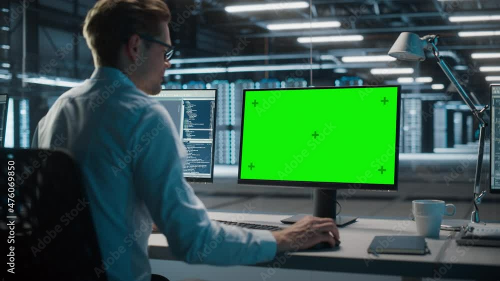 Poster High-Tech Data Center Server: IT Specialist Administrator Working on Green Screen Chroma Key Computer. Monitoring Web Services, Cloud Computing, Analytics Facility, Maintenance of Cyber Security