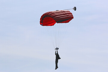 Skydiver in a blue sky	