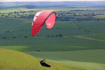 Paraglider flying in the Pewsey Vale, Wiltshire	