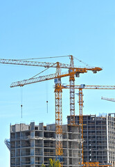 Fototapeta premium Crane and highrise construction site