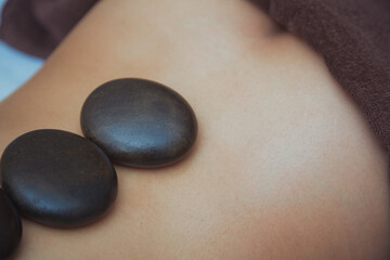 Back of woman laying in spa center