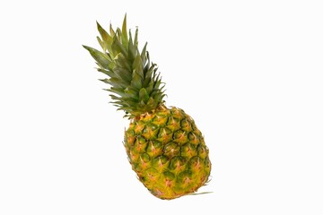 Pineapple on a white background. Clipping paths. Golden ripe pineapple fruit on a white background. Healthy nutrition